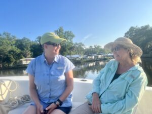Lisa Rinaman and Jessica Finch on St. Johns RIVERKEEPER's boat, the Kingfisher, in Putnam County