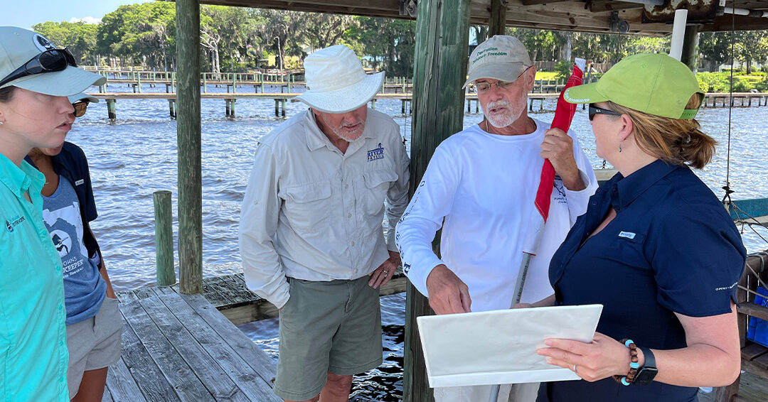 Zoe Tressel, Steve Cobb, Ben Williams and Lisa Rinaman on a dock in St. Johns County